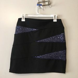 Black midi skirt with blue sequined accent.